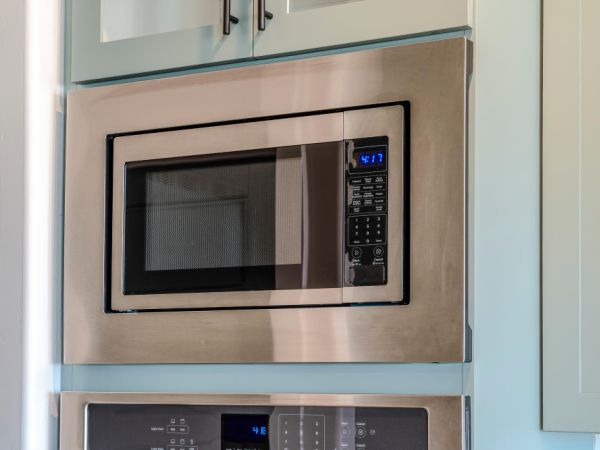 built-in microwave oven with chrome surround in a kitchen