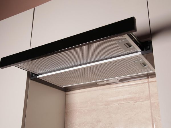 a telescopic cooker hood with a black front, it is extended 