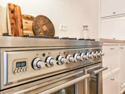 Close up of a silver range cooker in a kitchen